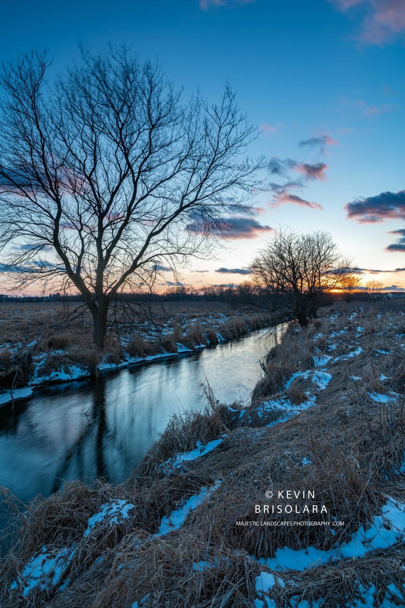 ENJOYING THE PEACEFUL SCENE ALONG THE CREEK