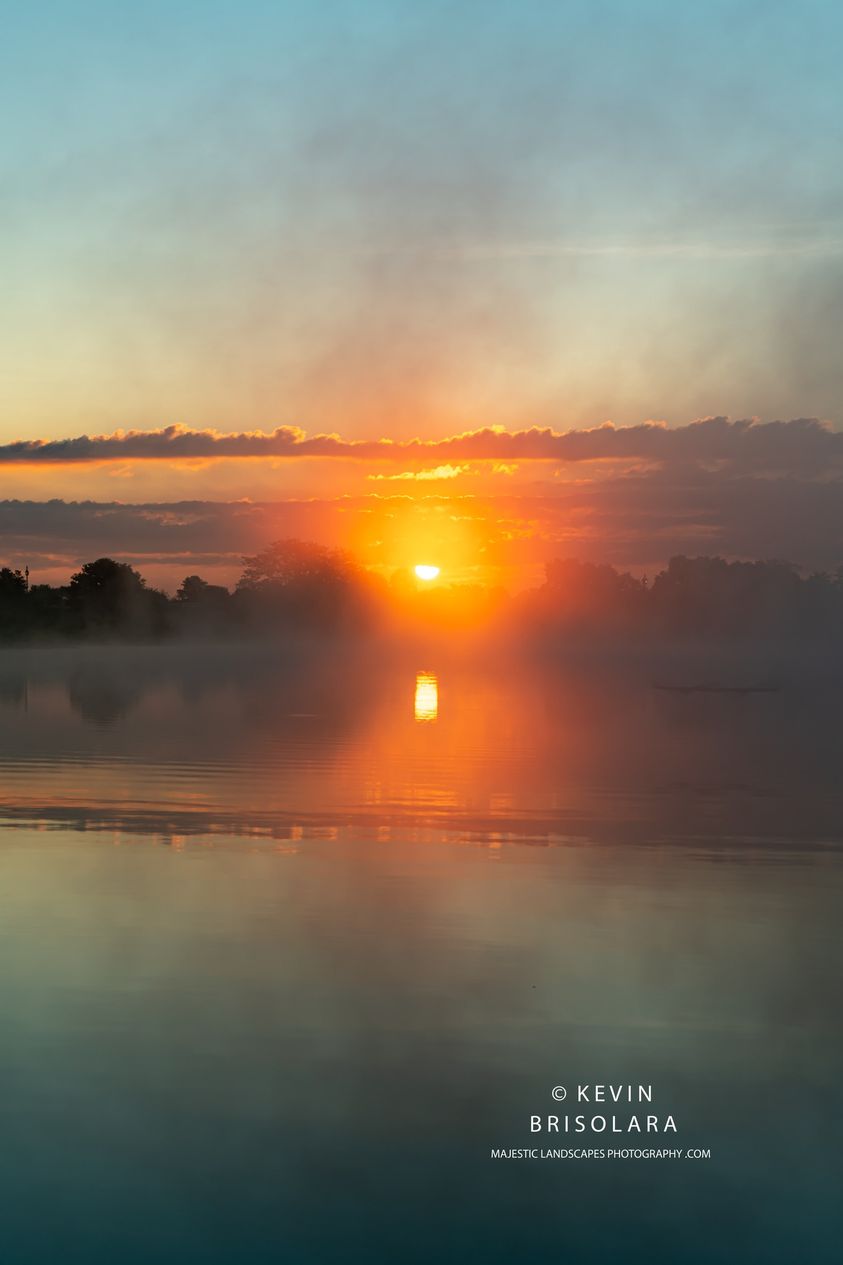 A MISTY SUNRISE AT WILDFLOWER LAKE