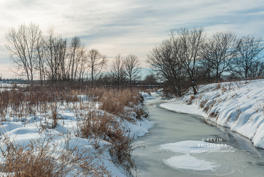 A WINTER WONDERLAND SCENE ALONG THE RIVER